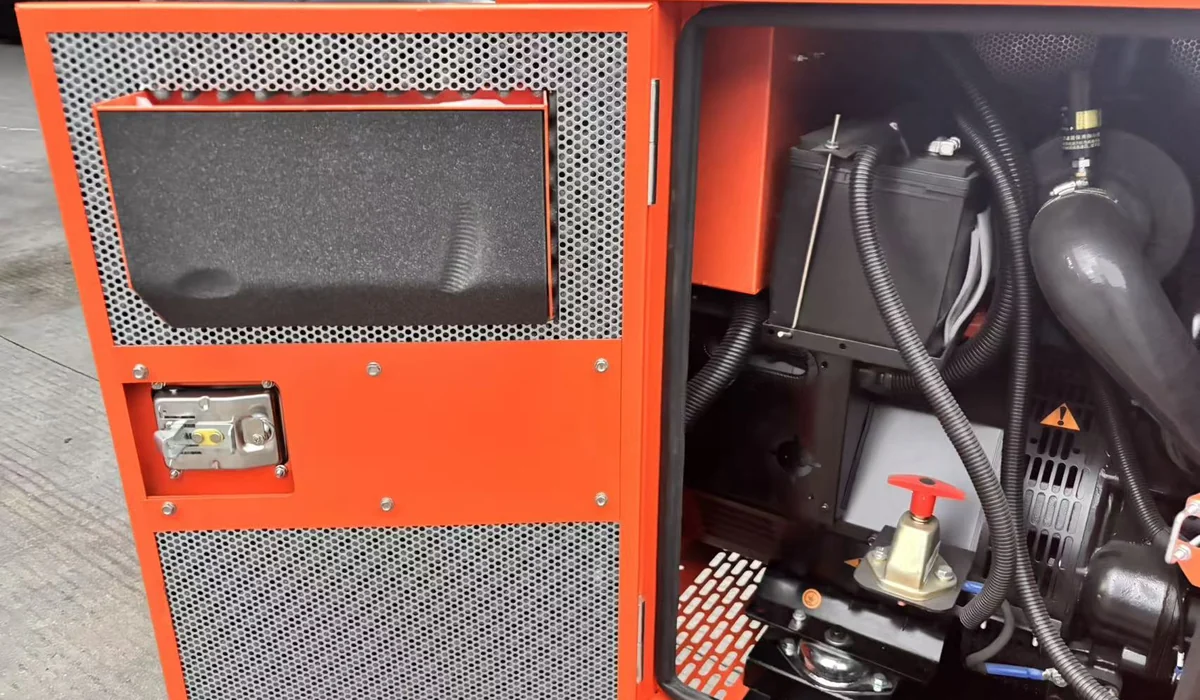 Open service door of the SG 30 kW canopy with a foam-lined perforated panel and a lockable latch, showing the battery and battery isolator switch inside